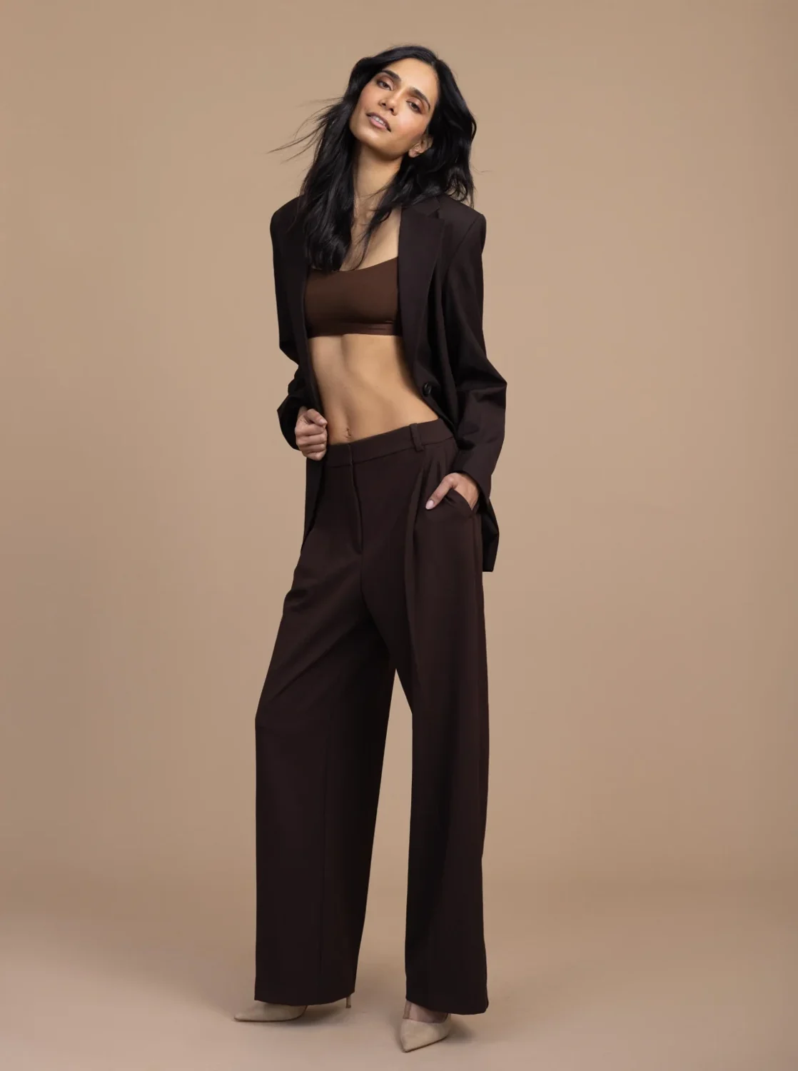 Model Bridge founder Yashi Verma James in a black tailored outfit